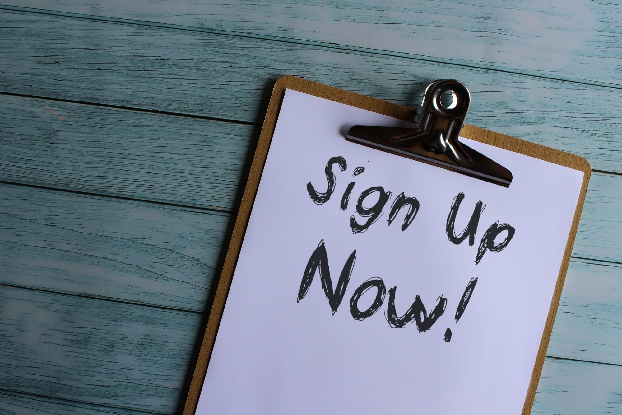 Paper clipboard with text Sign Up Now!